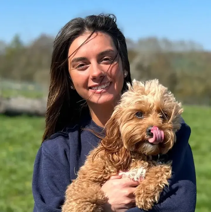 Amy, General Manager at Capital Dog Care, with a dog